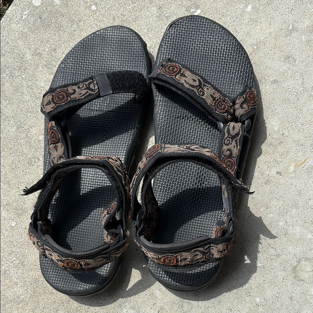 Teva Black Sandals with Tan Patterned Straps